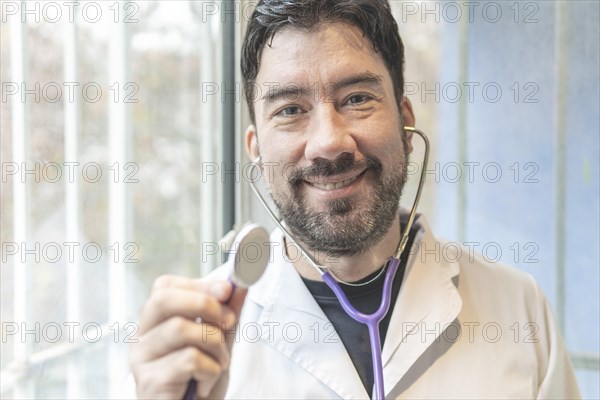 Latin cardiologist smiling at the camera