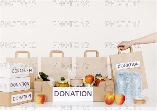 Front view donation boxes bags with food