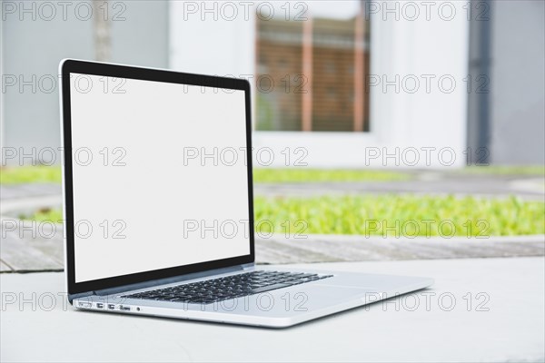 Laptop with blank white screen walkway