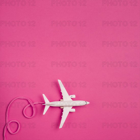 Toy plane with pink lace
