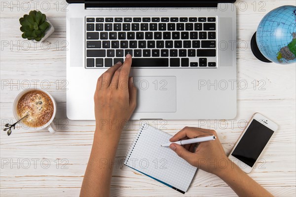 Flat lay person typing writing