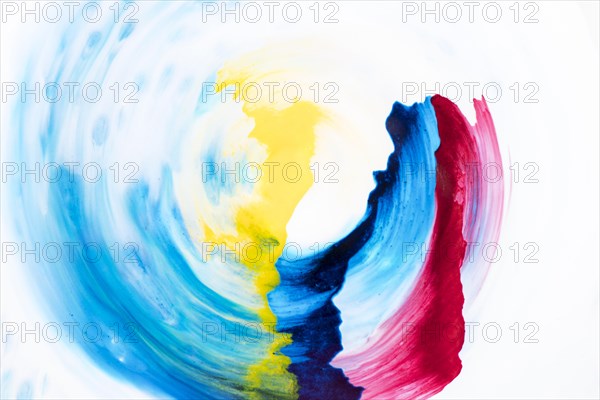 Decorative watercolor brush strokes circular form white paper
