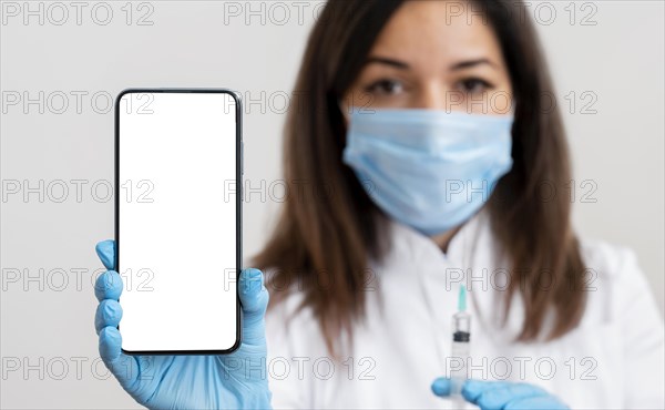 Doctor holding mobile phone