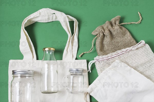 Flat lay different zero waste products green background