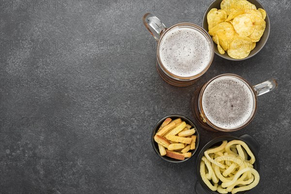 Top view beer snacks stucco background