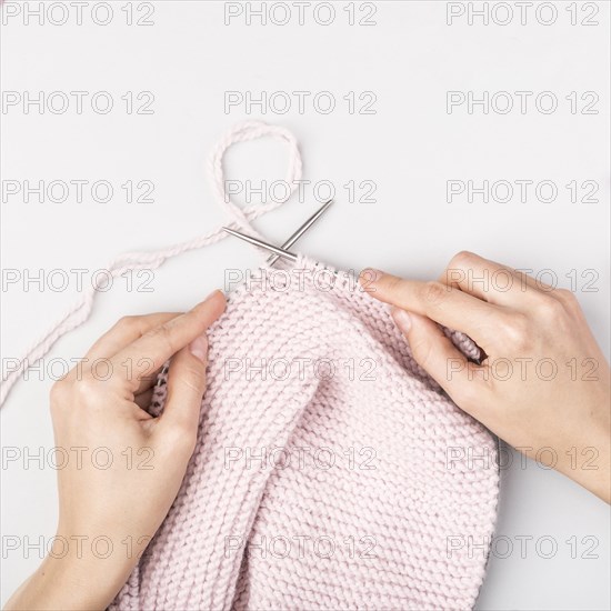 Top view woman knitting