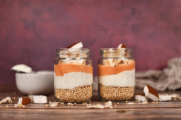 Healthy layered breakfast or dessert with puffed quinoa grains