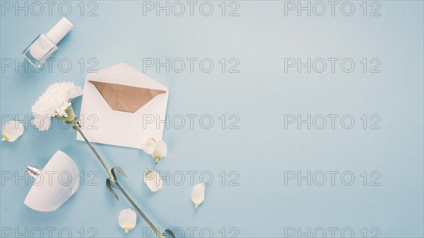 Envelope with white flower perfume table