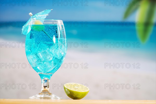 Glass cooling blue drink sliced lime
