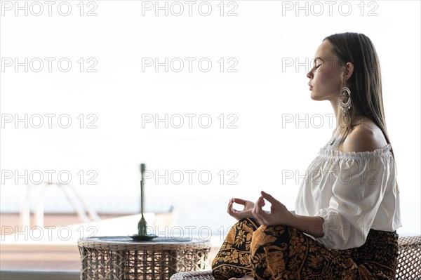 Woman meditating outdoors