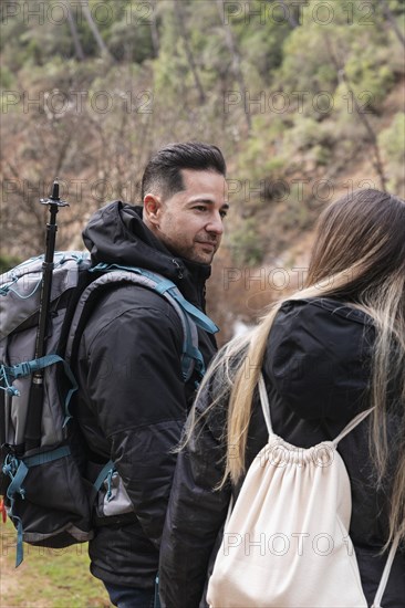 Couple with backpack exploring nature 7