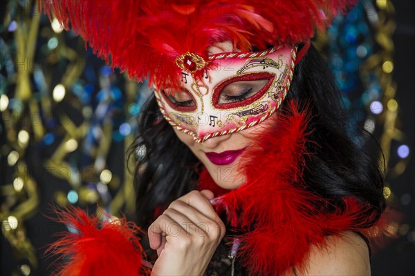 Elegant woman celebrating venetian carnival