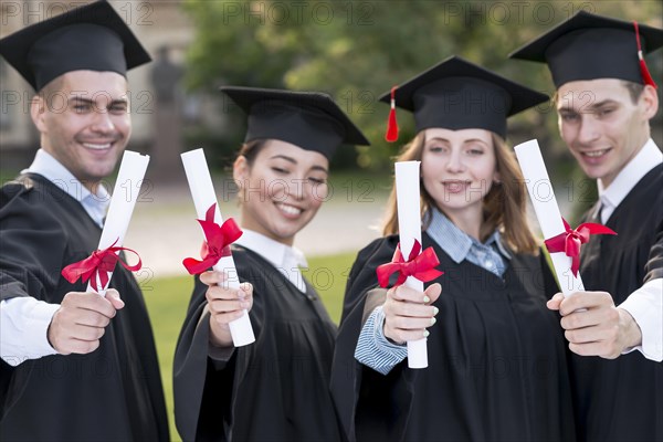 Portrait group students celebrating their graduation