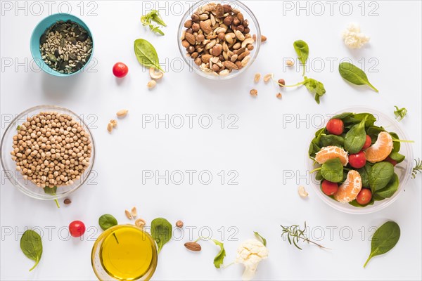 Top view healthy ingredients bowls white background with blank space text