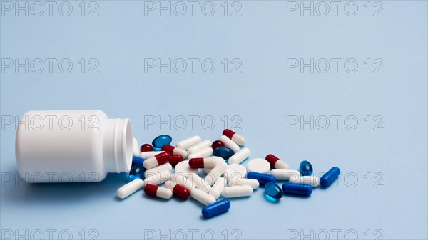 White pill container blue background