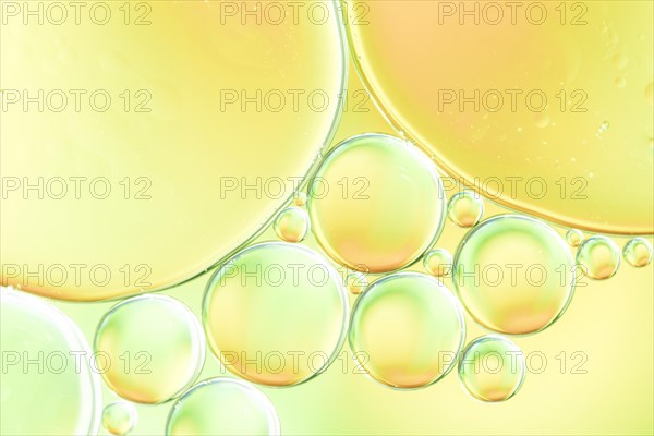Green yellow bubbles glowing drops