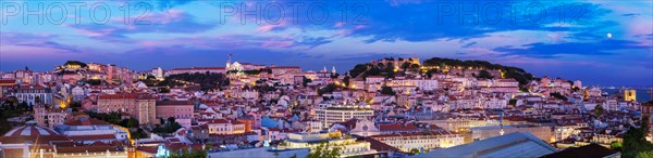 Panorama of Lisbon famous view from Miradouro de Sao Pedro de Alcantara tourist viewpoint in the evening. Lisbon