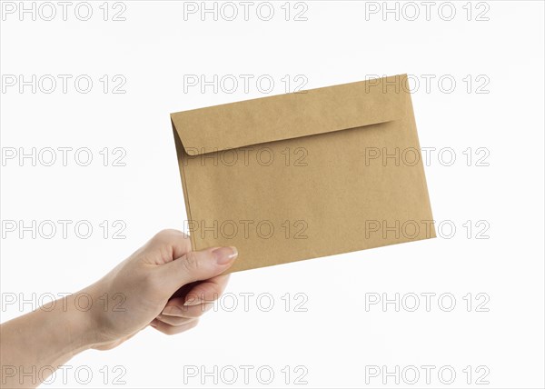 Hand holding envelope