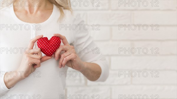 Close up woman with little heart