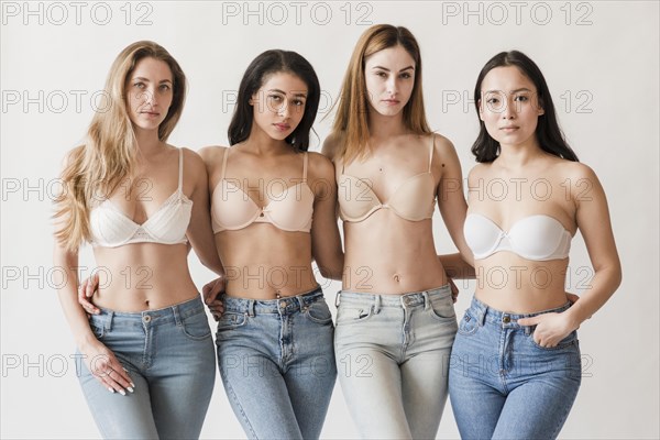 Multiracial group young women wearing bras looking camera