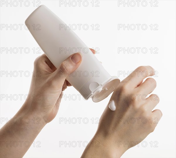 Hands using lotion