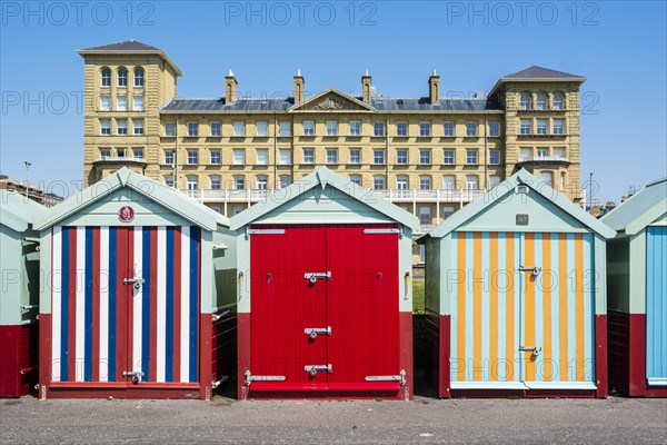 Row of beautiful colourful seaside bathing cottages in Brighton and Hove