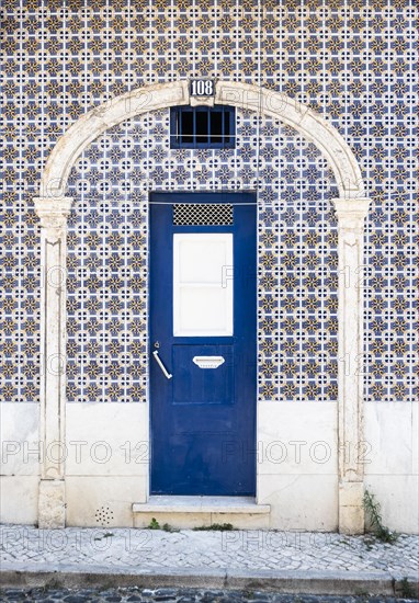 Facade with painted tiles