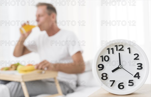 Medium shot blurred man having breakfast 8 m
