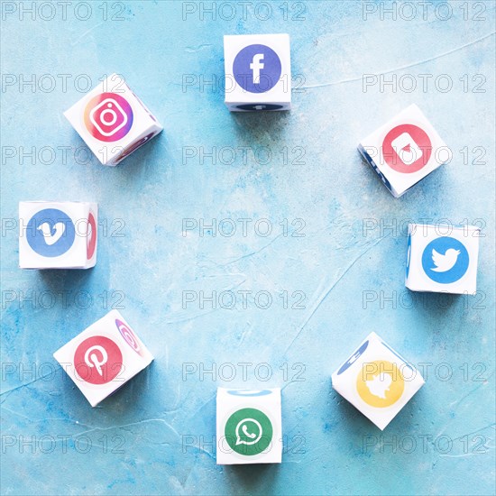 Blocks social media icons arranged circular shape textured background