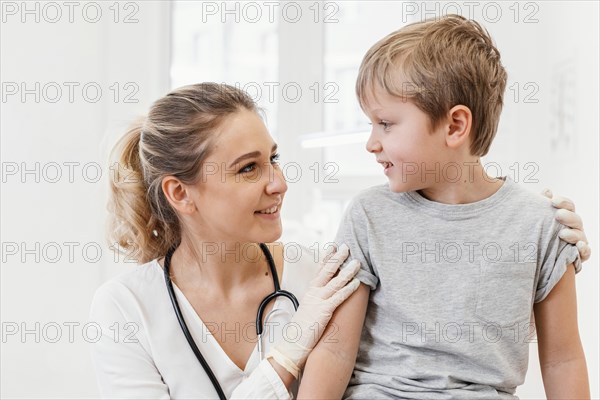 Medium shot doctor kid