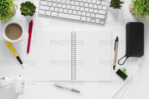 Tea cup plant pots spiral notepad tea cup pens white desk