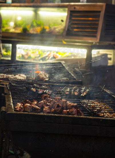 Fish and meat on a grill of a restaurant in the old town of Lisbon