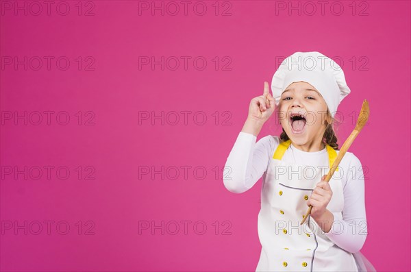 Girl cook ladle showing index finger