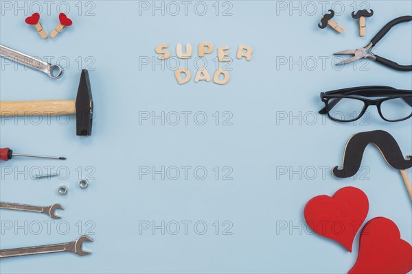 Super dad inscription with tools glasses