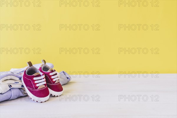 Newborn concept with shoes clothes