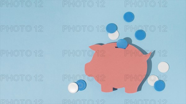 Top view piggy bank blue background