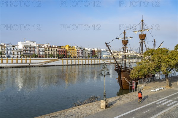 Replica of the Nao Victoria 500 and the colourful houses of the Triana district on the Guadalquivir River