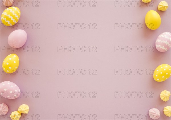 Colourful easter eggs with small sweets table