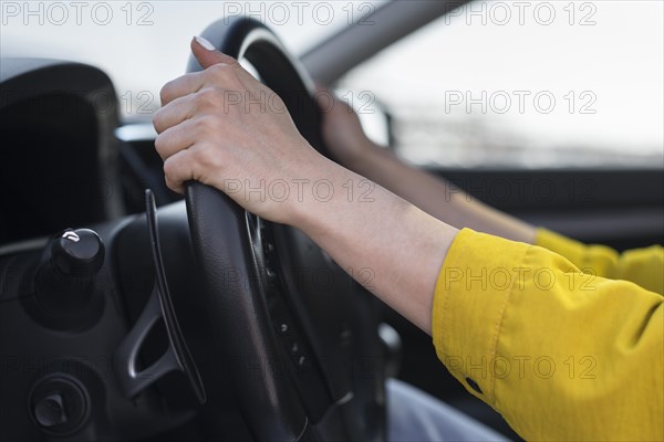 Close up hands steering wheel