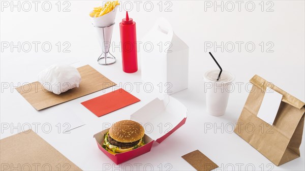 Fast food disposal cup sauce bottle parcel white background