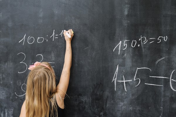 Girl solving math exercise