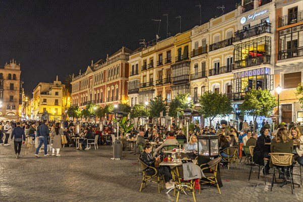 Crowded restaurants and bars in Plaza de San Francisco square at night