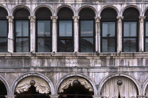 Close frontal shot of facade of Procurate Vecchie building in St Mark's square or piazza San Marco