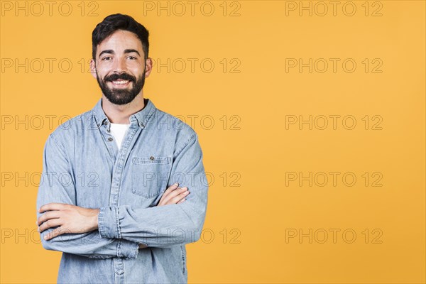 Medium shot smiley guy crossed arms