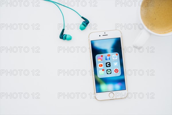 Phone with apps coffee mug earphones