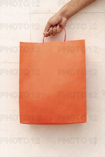 Close up shopping bag holding by hand