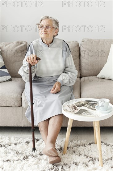 Portrait elderly grandmother sitting sofa