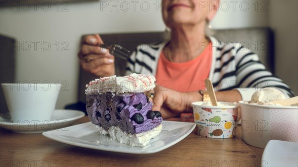 In a cafe. Colorful cake