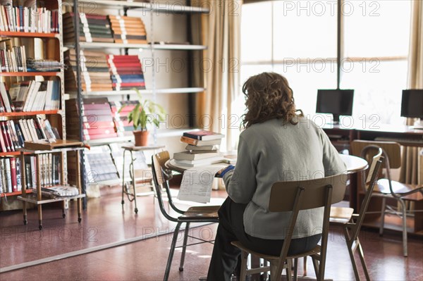 Anonymous woman working library