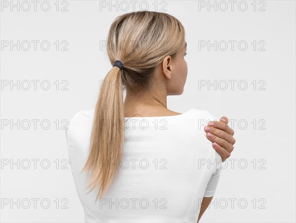 Back view woman with shoulder pain